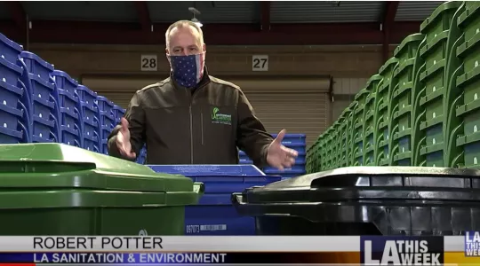 Screenshot of an image from LA This Week featuring Robert Potter explaining what goes in each bin.
