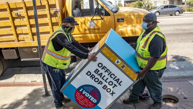 voting boxes 2020 being placed by two StreetsLA workers